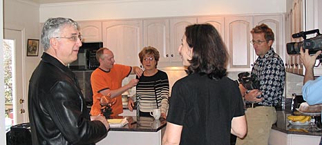 Director Julie Checkoway talks to Jim and Cookie Pappas in their kitchen as sound recordist Robin Hilton, cinematographer Richard Chisolm and assistant director Steve Lickteig make preparations to shoot.